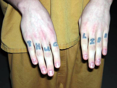 Suspected Gang Member with Words “Thug / Life” Tatooed Across Knuckles