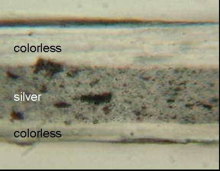 Figure 4 shows the micrograph of the cross section of tape Sample 81 magnified 250 times. The backing appears to have three layers.