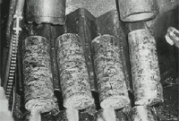 Photograph of solidified billets of lead.