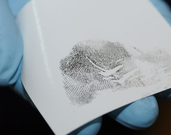 Figure 8 shows a fingerprint reviewed by the examiner to confirm that a clear and complete impression was recorded that is of suitable quality for comparison.