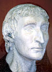 Photograph of a detailed plaster model of Anital Simon's head, hair and eyebrows added, with the portrait superimposed to show how closely the features match