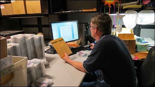 Man at Computer with Digital Evidence