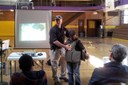 On April 27, 2013, Special Agent Ken Schmittlein, along with volunteers from the Detroit FBI Field Office, participated in a boys’ youth leadership conference at Cristo Rey High School. Above, Agent Schmittlein gives a presentation on firearms safety and helps a sixth-grader try on an FBI bulletproof vest.