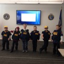 On February 27, 2015, the FBI Detroit Division hosted an office visit for Cub Scouts Pack 1786, Den 5. The scouts learned about what the FBI investigates, how to become an FBI agent, and how to collect evidence like fingerprints. Parents and scouts also had an opportunity to try on FBI ballistic vests and other tactical gear. 
