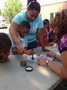 The FBI New Haven Evidence Response Team (ERT) visited the Boys & Girls Club of New Haven Summer Fun and Learning Camp in July and August. Approximately 200 campers, ages 5-14, attended the ERT event and were provided FBI folders containing Child ID Kits, ERT information, and a Junior Special Agent Handbook. Campers, like those in the photo above, also had the opportunity to practice magnetic fingerprint dusting on paper. 