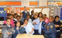 Recently, FBI volunteers from the New York Field Office participated in Read Aloud Day at Public School 5, Port Morris School in the Bronx. After reading to students, FBI Community Outreach Specialist Kevin Mannion (pictured above with a class) and Special Agent Shawn Mullen answered the students’ questions about the FBI and helped them try on raid jackets.