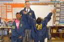 Recently, FBI volunteers from the New York Field Office participated in Read Aloud Day at Public School 5, Port Morris School in the Bronx. After reading to students, FBI Community Outreach Specialist Kevin Mannion (pictured above with two students) and Special Agent Shawn Mullen answered the students’ questions about the FBI and helped them try on raid jackets.