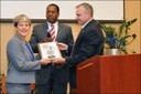 On September 27, 2012, Acting Special Agent in Charge Juan Molina (right) and Assistant Special Agent in Charge Willie Session of the Norfolk FBI office honored Assistant Chief Sharon L. Chamberlin of Norfolk Police Department at her retirement ceremony for her partnership and work with the FBI.