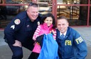 Recently, the FBI Omaha Division helped make a young cystic fibrosis patient’s dream come true. Through the Make-A-Wish Foundation, Sheyla (pictured with an Urbandale (Iowa) Police Department officer and an FBI agent from our Des Moines Resident Agency) played a superhero for the day. “Super Sheyla” spent the day working a mock investigation with real FBI agents and police officers, tracking down the villain “Kill-O-Watt” before he could shut off the power in Des Moines, Iowa.