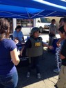 On October 19, 2014, the FBI San Francisco Field Office participated in the annual Greenfield Harvest Festival held in Greenfield, California. Festival-goers learned about FBI programs such as Safe Online Surfing and tried on FBI gear, as demonstrated by the young man above. 