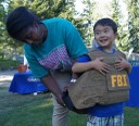 On August 5, 2014, FBI Seattle Division employees participated in a National Night Out event in Mountlake Terrace, where families learned about the FBI and crime prevention in a community-oriented environment. Kids also got to try on FBI gear, like a 35-pound bulletproof vest, above. 