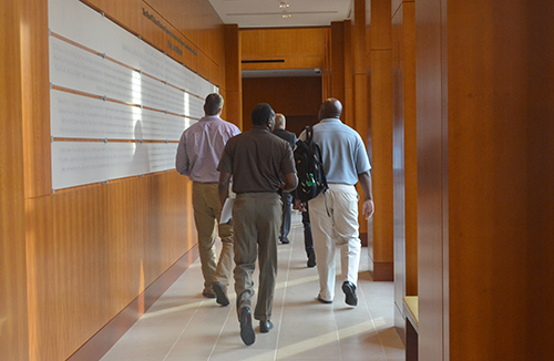 National Executive Institute Students Walking in a Hallway